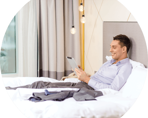 Businessman in hotel using smart room features